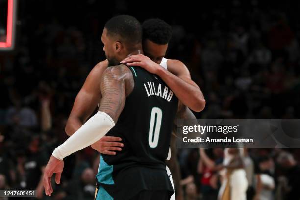 Damian Lillard of the Portland Trail Blazers and CJ McCollum of the New Orleans Pelicans hug following a game at Moda Center on March 01, 2023 in...