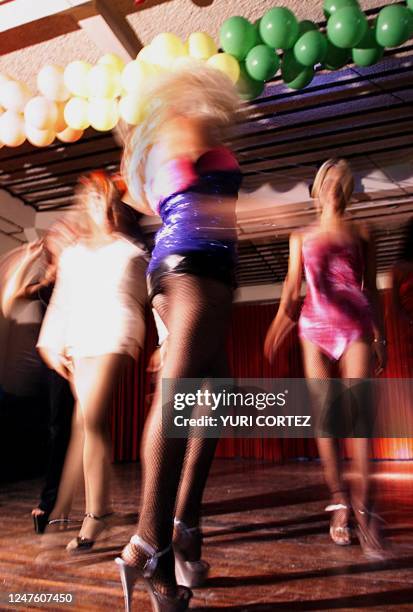 Homosexuals participate in a fashion parade 23 June, 2000 as part of the activities the gay community held to commemorate the World Gay Pride Day in...