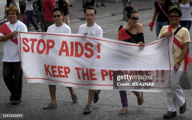 Gay members of the Olongapo City Aids Council Advocates Group display banners during a march to mark World Aids Day in Olongapo city, Zambales,...