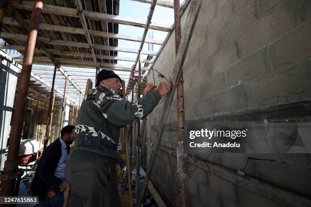 Year-old Palestinian construction worker Youssef al-Sheikh Hussein works in a building construction in Salfit, West Bank on February 14, 2023....