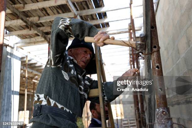 Year-old Palestinian construction worker Youssef al-Sheikh Hussein works in a building construction in Salfit, West Bank on February 14, 2023....