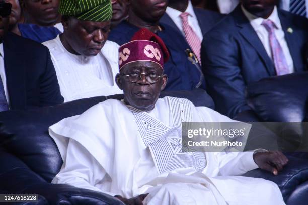 Nigeria's President-elect Bola Tinubu sits at the International Centre waiting to receive his certificate of return by the Independent National...