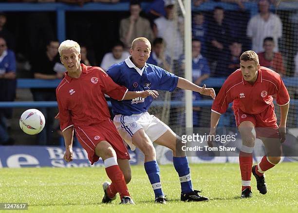 Glynn Hurst of Chesterfield is challenged by Andrew Davis of Middlesbrough during the Chesterfield v Middlesbrough pre-season friendly match at...