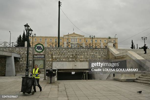 Street cleaner operates next to a closed metro station due to a 24-hours strike by employees following the deadly train accident late on February 28,...