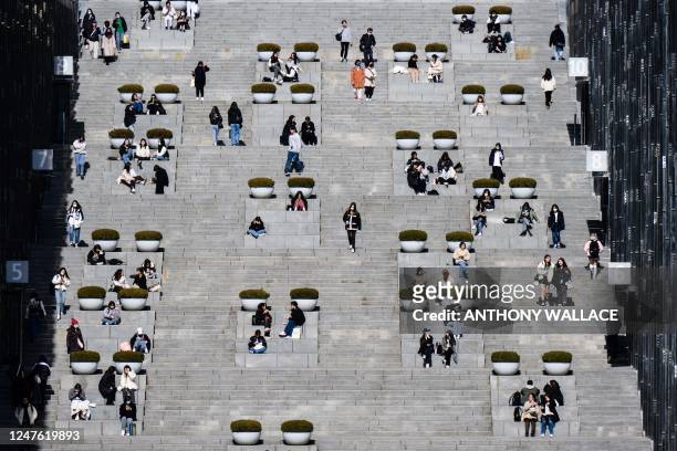Students and visitors walk around the campus of Ewha Womans University in Seoul on March 2 which was founded in 1886.