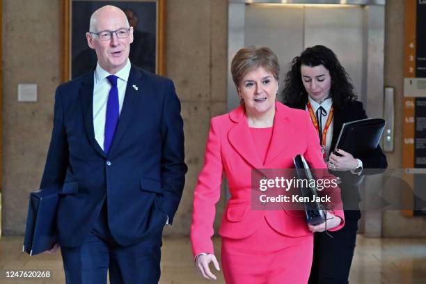 First Minister Nicola Sturgeon on the way to First Minister's Questions in the Scottish Parliament, accompanied by her deputy John Swinney, on March...