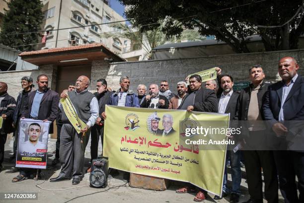 Palestinians, holding banners and photos of Palestinian prisoner, gather to stage protest to show solidarity with Palestinian prisoner in Israeli...