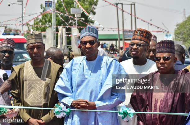 Nigerian President Muhammadu Buhari visit the Maiduguri Monday Market during a visit on March 2 after the market burned down on February 26, 2023.