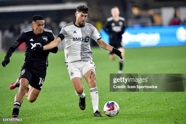United defender Andy Najar defends against Toronto FC midfielder Jonathan Osorio during the Toronto FC versus D.C. United Major League Soccer game on...