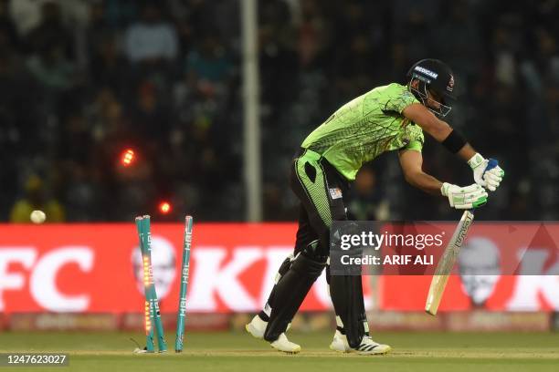 Lahore Qalandars' Hussain Talat is clean bowled by Quetta Gladiators' Naveed ul Haq during the Pakistan Super League T20 cricket match between Lahore...