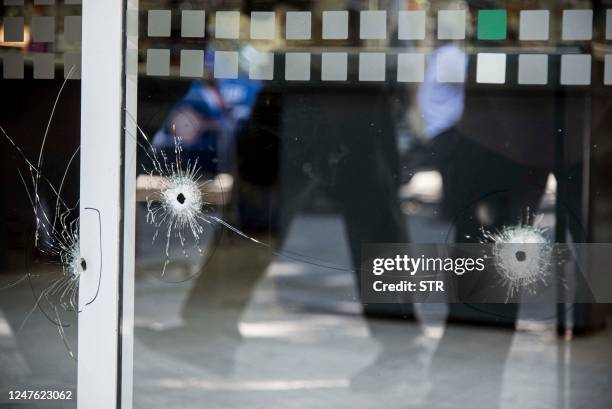 Picture of bullet holes in a window of a supermarket belonging to the family of Antonela Roccuzzo, the wife of Argentine football star Lionel Messi,...