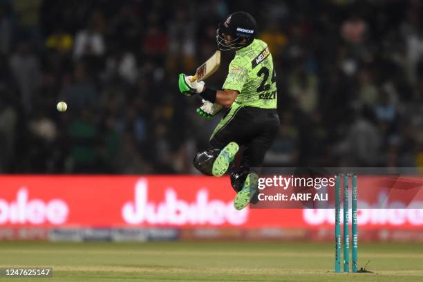 Lahore Qalandars' Sikandar Raza plays a shot during the Pakistan Super League T20 cricket match between Lahore Qalandars and Quetta Gladiators at the...