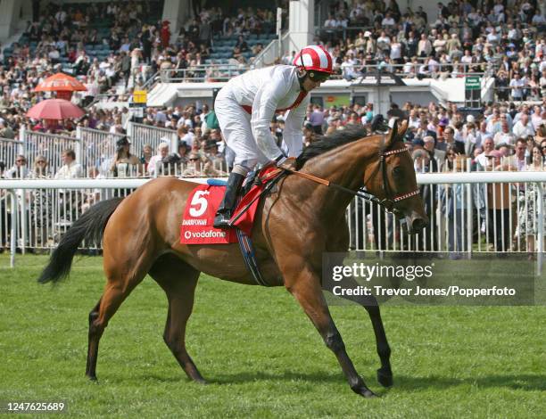 Irish Jockey Eddie Ahern riding Darrfonah cantering to post for the Oaks at Epsom, 1st June 2007.