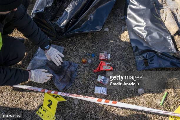 The police exhume the bodies of 3 men killed during the Russian attacks in the town of Borodyanka near Kyiv, Ukraine March 2, 2023.