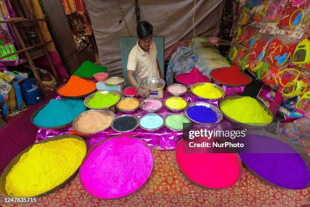 Man is seen organizing various colored powder or ' Abir' for sale ahead of Holi festival celebration in Kolkata , India , on 3 March 2023 . Holi is...
