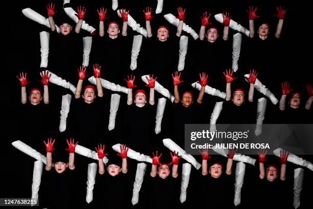 Dancers, wearing Louboutin shoes, perform to celebrate the 30th anniversary of the red sole on the sidelines of the Paris Fashion Week at the Opera...