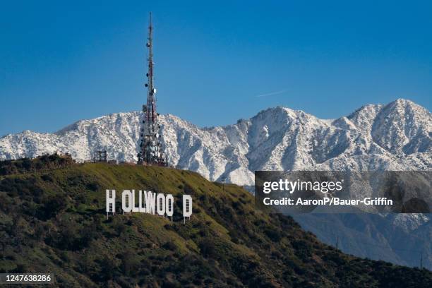 View of the Hollywood Sign atop Mount Lee against the snow-covered San Gabriel Mountains on March 02, 2023 in Hollywood, California.