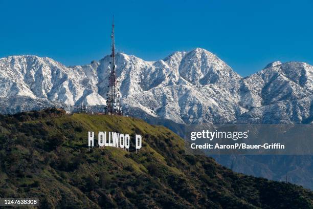 View of the Hollywood Sign atop Mount Lee against the snow-covered San Gabriel Mountains on March 02, 2023 in Hollywood, California.