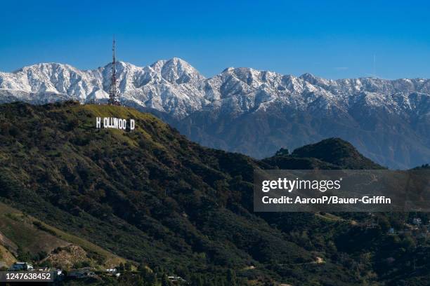 View of the Hollywood Sign atop Mount Lee against the snow-covered San Gabriel Mountains on March 02, 2023 in Hollywood, California.