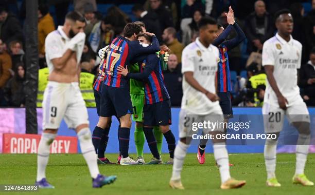 Barcelona players celebrate their win at the end of the Copa del Rey semi final first leg football match between Real Madrid CF and FC Barcelona at...