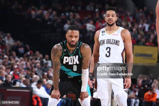 Damian Lillard of the Portland Trail Blazers and CJ McCollum of the New Orleans Pelicans looks on during the game on March 1, 2023 at the Moda Center...