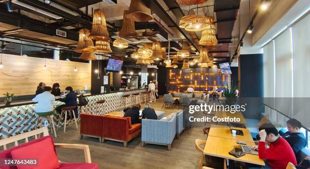 The work environment of WeWork, a US co-working space provider and maker leader, is seen in Shanghai, China, March 2, 2023. While "co-working" was a...