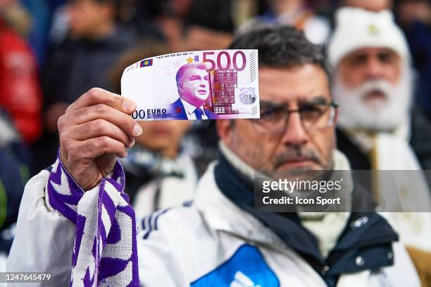 Fans of Real Madrid CF with a money Florentino Perez during the Copa del Rey, semi-final match between Real Madrid and FC Barcelona at Estadio...
