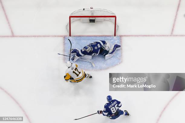 Goalie Andrei Vasilevskiy of the Tampa Bay Lightning stretches to make a save against Bryan Rust of the Pittsburgh Penguins during the first period...