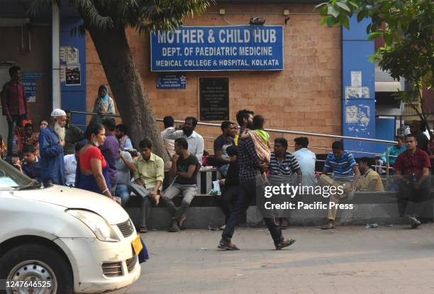 Patients' relatives waiting outside a government-run hospital amid the spread of Adenovirus. Adenovirus commonly cause respiratory symptoms related...