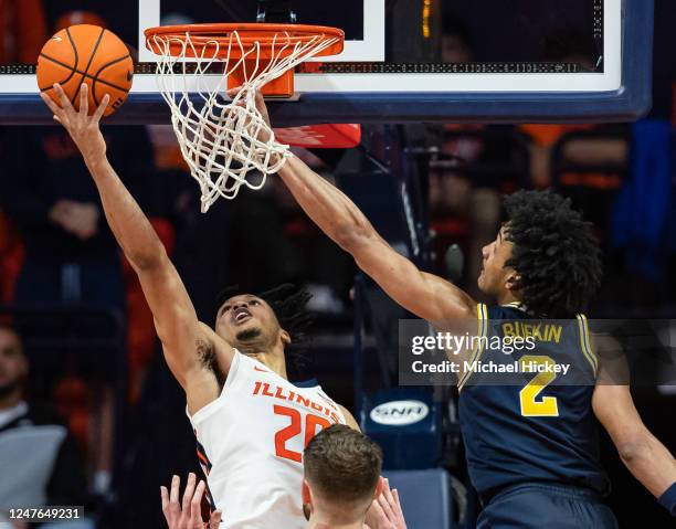 Ty Rodgers of the Illinois Fighting Illini shoots the ball against Kobe Bufkin of the Michigan Wolverines during the second half at State Farm Center...