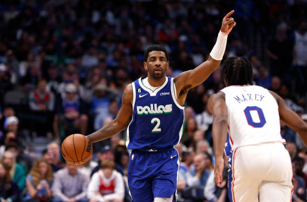 Kyrie Irving of the Dallas Mavericks calls a play against the Philadelphia 76ers in the second half at American Airlines Center on March 2, 2023 in...