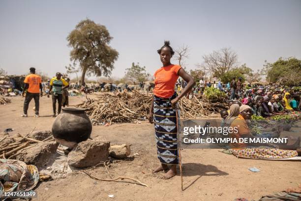 The healer Amsétou Nikiéma, nicknamed Adja stands in the village of Toeghin Peulh, near Ouagadougou, on February 28, 2023. - Thousands of people have...