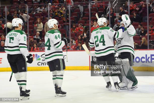 Roope Hintz of the Dallas Stars reacts with goalie Matt Murray after the Stars defeat the Chicago Blackhawks 5 to 2 at United Center on March 02,...