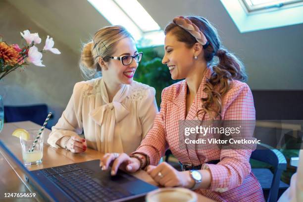 young happy business women using laptop - aleksandra cvetkovic stock pictures, royalty-free photos & images