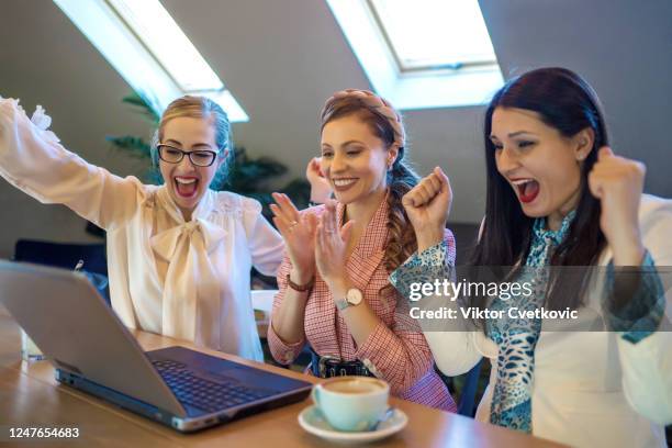 young happy business women using laptop - aleksandra cvetkovic stock pictures, royalty-free photos & images