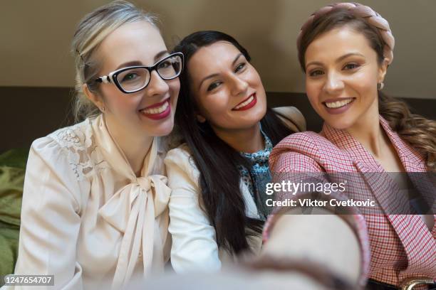 women taking a selfie in a cafe - aleksandra cvetkovic stock pictures, royalty-free photos & images