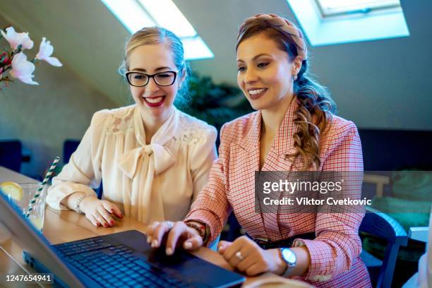 young business women using laptop - aleksandra cvetkovic stock pictures, royalty-free photos & images