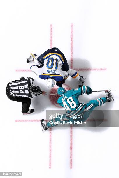 An overhead view as Tomas Hertl of the San Jose Sharks takes a face-off against Brayden Schenn of the St. Louis Blues at SAP Center on March 2, 2023...