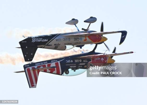 Matt Hall and Emma McDonald of the Red Bull aerobatic team perform during the Australian International Airshow Aerospace and Defence Expo at Avalon...
