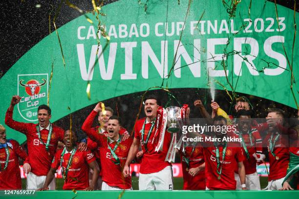 Harry Maguire of Manchester United celebrates with the trophy among team mates during the Carabao Cup Final match between Manchester United and...