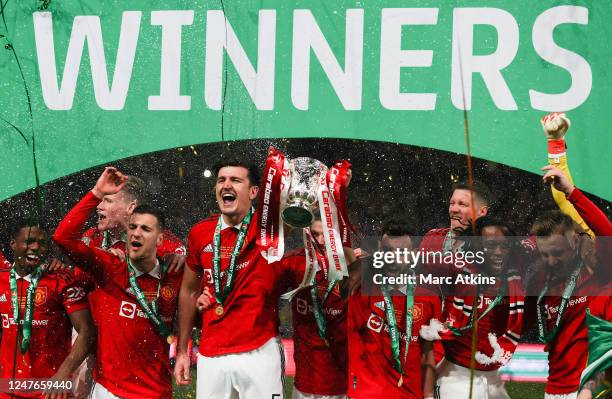 Harry Maguire of Manchester United celebrates with the trophy among team mates during the Carabao Cup Final match between Manchester United and...