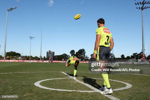 Umpires practice a centre bounce during the 2023 AFL practice match between the West Coast Eagles and the Adelaide Crows at Mineral Resources Park on...