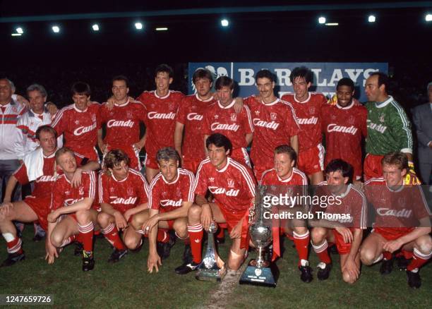 Liverpool celebrate with the League Championship trophy following the Barclays League Division One match between Liverpool and Derby County at...