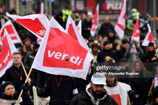 Striking public transport workers and activists from the Fridays for Future climate movement walk with flags during a protest on March 3, 2023 in...