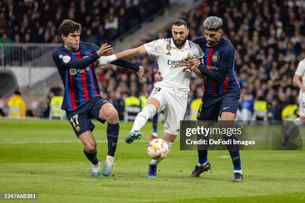 Marcos Alonso of FC Barcelona, Karim Benzema of Real Madrid and Ronald Araujo of FC Barcelona battle for the ball during the Copa Del Rey Semi Final...