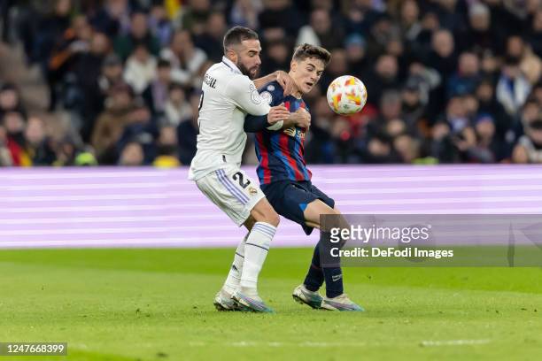Dani Carvajal of Real Madrid and Gavi of FC Barcelona battle for the ball during the Copa Del Rey Semi Final Leg One match between Real Madrid CF and...