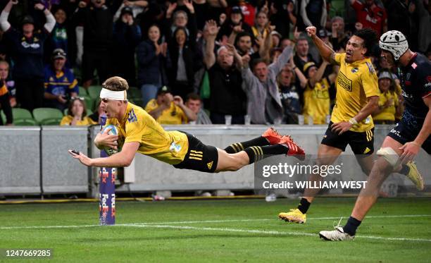 Hurricanes' Jordie Barrett dives over to score a try during the Super Rugby match between the Melbourne Rebels and Wellington Hurricanes at the AAMI...