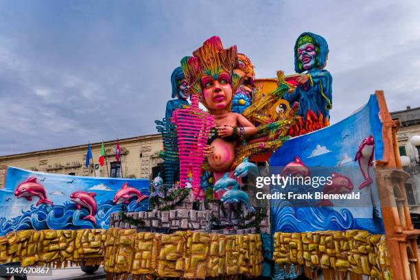 Huge floats with colourful, moving figures are pulled through the streets of the town during the Acireale Carnevale.