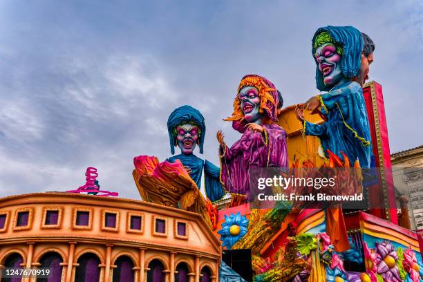 Huge floats with colourful, moving figures are pulled through the streets of the town during the Acireale Carnevale.