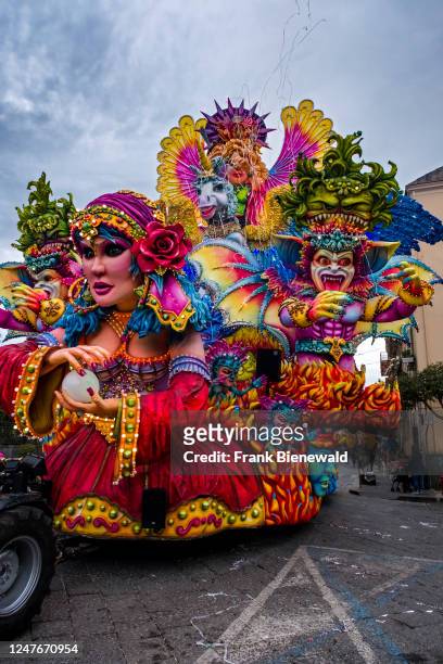 Huge floats with colourful, moving figures are pulled through the streets of the town during the Acireale Carnevale.